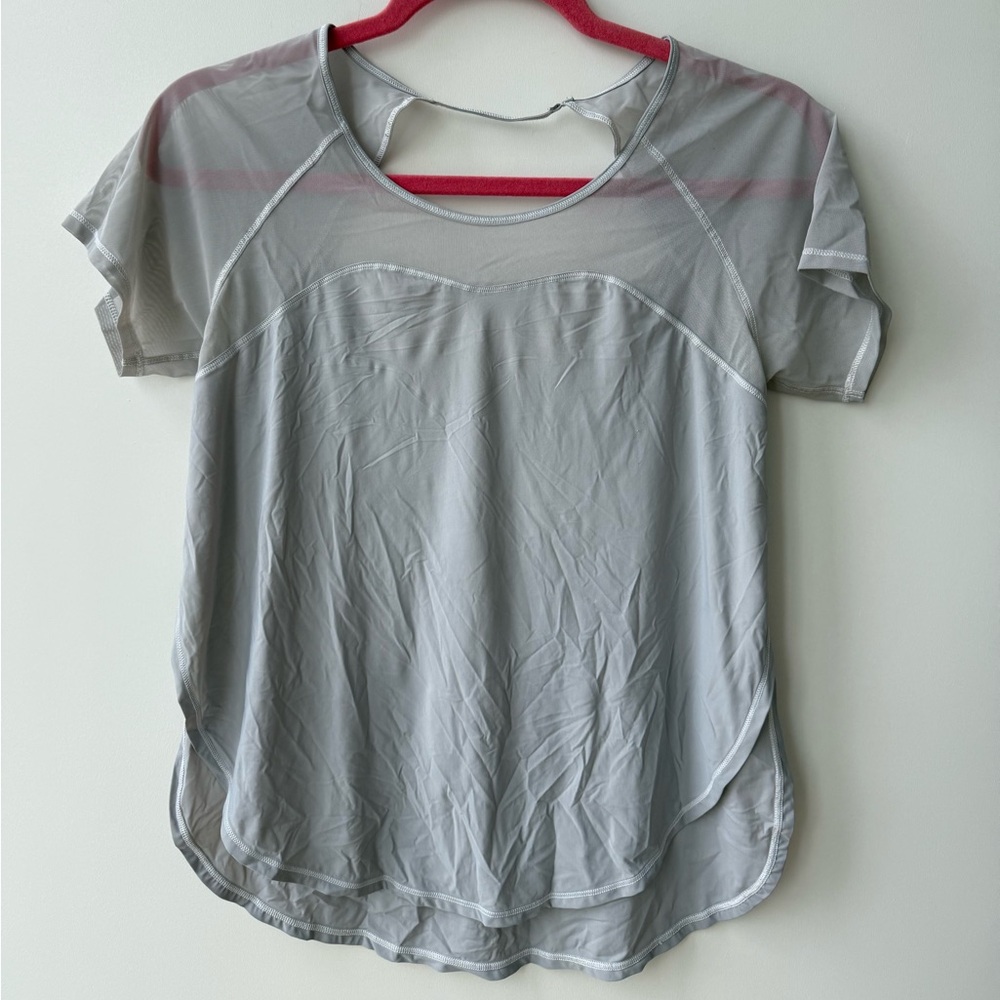 Lululemon grey short sleeve with mesh top detail, side slits, and open back